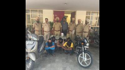The men suspected of robbing a scrap shop in custody of Ludhiana police on Sunday.