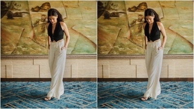 Taapsee chose a monochrome outfit for this promotional look. It features a sleeveless black crop top and white pants. While the top comes with front button closures, an asymmetric cropped hem baring her midriff and a plunging V neckline, the pants have a flared silhouette, a pleated front and a high-rise waist. Open tresses, black strappy pumps and minimal makeup rounded it all off. (Instagram/@dev213) Taapsee chose a monochrome outfit for this promotional look. It features a sleeveless black crop top and white pants. While the top comes with front button closures, an asymmetric cropped hem baring her midriff and a plunging V neckline, the pants have a flared silhouette, a pleated front and a high-rise waist. Open tresses, black strappy pumps and minimal makeup rounded it all off. (Instagram/@dev213)