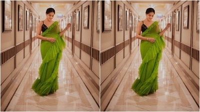 Taapsee brought retro vibes to Dobaaraa promotions in this parrot green ruffled saree and a sleeveless black blouse. A simple hairdo and glam makeup pick enhanced the modern traditional vibe of this fit. (Instagram/@dev213) Taapsee brought retro vibes to Dobaaraa promotions in this parrot green ruffled saree and a sleeveless black blouse. A simple hairdo and glam makeup pick enhanced the modern traditional vibe of this fit. (Instagram/@dev213)