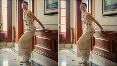 Taapsee Pannu serves a 'too cool for school' vibe in this all-white ensemble. She wore a sleeveless crop top with notch lapel collars, multicoloured patchwork, and faux wrapover front. The actor chose a pulled-back updo, minimal jewellery, lace-up sneakers and flared pants to complete the outfit. (Instagram/@dev213) Taapsee Pannu serves a 'too cool for school' vibe in this all-white ensemble. She wore a sleeveless crop top with notch lapel collars, multicoloured patchwork, and faux wrapover front. The actor chose a pulled-back updo, minimal jewellery, lace-up sneakers and flared pants to complete the outfit. (Instagram/@dev213)