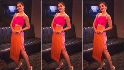 Taapsee made a case for colour-block fashion in this ensemble featuring a hot pink crop top and orange-pink double-tone skirt with a side thigh-high slit. Pointed pumps, hoop earrings and subtle makeup concluded the look. (Instagram/@dev213) Taapsee made a case for colour-block fashion in this ensemble featuring a hot pink crop top and orange-pink double-tone skirt with a side thigh-high slit. Pointed pumps, hoop earrings and subtle makeup concluded the look. (Instagram/@dev213)