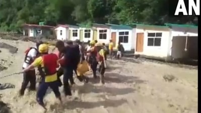 Tourists being rescued by the SDRF team from the resort. (@ANINewsUP/ Twitter) Tourists being rescued by the SDRF team from the resort. (@ANINewsUP/ Twitter)