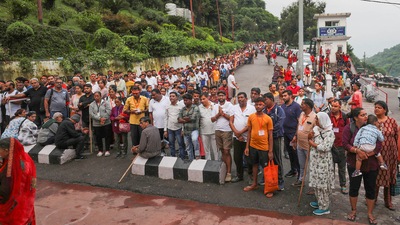 Reasi: Pilgrims return after authorities temporarily suspended the pilgrimage to Mata Vaishno Devi shrine following heavy monsoon rains. (PTI) Reasi: Pilgrims return after authorities temporarily suspended the pilgrimage to Mata Vaishno Devi shrine following heavy monsoon rains. (PTI)