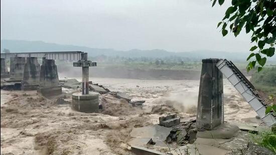 The bridge that collapsed following heavy rains in Chakki, Kangra, Himachal Pradesh, on August 20. (Reuters)