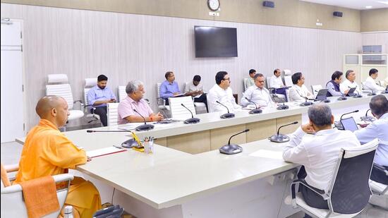 Uttar Pradesh chief minister Yogi Adityanath at a high-level meeting in Lucknow on Sunday. (HT PHOTO)