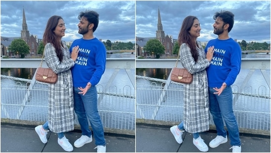 In this click, Disha and Rahul seem to have been captured in a candid moment while standing on a bridge in Europe. The backdrop shows cloudy skies, stunning landscapes, clear blue waters of the river, and much more.(Instagram)