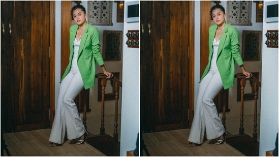 Taapsee turned boss babe in this white bustier top and flared pants set teamed with an oversized parrot green blazer. Her signature curly hair tied in a messy bun and minimal makeup acted as a cherry on the cake. Which outfit do you like the most?(Instagram/@dev213)
