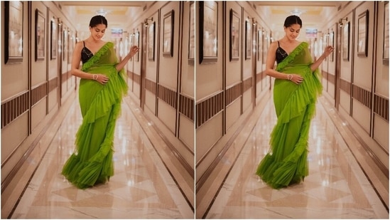 Taapsee brought retro vibes to Dobaaraa promotions in this parrot green ruffled saree and a sleeveless black blouse. A simple hairdo and glam makeup pick enhanced the modern traditional vibe of this fit.(Instagram/@dev213)