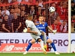 Kylian Mbappe scores his team's first goal during the Ligue 1 match between Lille OSC and Paris-Saint Germain.