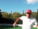 Roger Federer reacts to the camera during training.