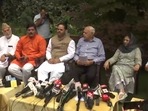 National Conference president Farooq Abdullah along with leaders from other political parties at his residence in Srinagar on Monday. &nbsp;
