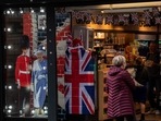 The downward revision in GDP reflected lower contributions from healthcare and retailers than previously thought. (Photographer: Chris J. Ratcliffe/Bloomberg)