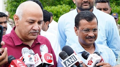 Delhi chief minister Arvind Kejriwal and deputy CM Manish Sisodia interact with media upon their arrival in Ahmedabad. (PTI)