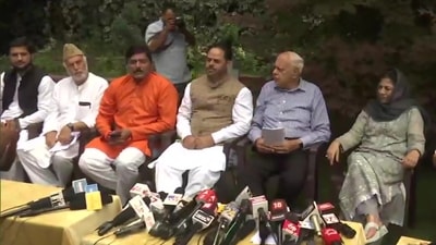 National Conference president Farooq Abdullah along with leaders from other political parties at his residence in Srinagar on Monday. &nbsp; (ANI)