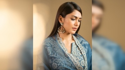 Mrunal Thakur's suit featured embroidery work in patches all over the material and a cut around the neckline. (Instagram/@mrunalthakur) Mrunal Thakur's suit featured embroidery work in patches all over the material and a cut around the neckline. (Instagram/@mrunalthakur)
