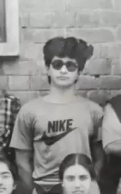 A monochrome photograph of KK from his college days.