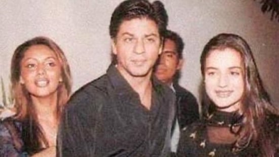 Ameesha Patel with Shah Rukh Khan and Gauri Khan at an event.