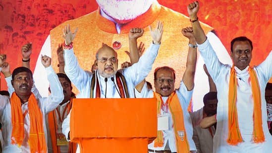 Amit Shah addresses a public meeting at Munugode in Nalgonda district.(PTI)