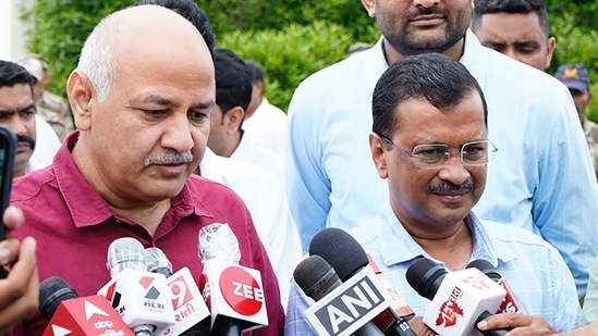 Delhi chief minister Arvind Kejriwal and deputy CM Manish Sisodia interact with media upon their arrival in Ahmedabad.(PTI)