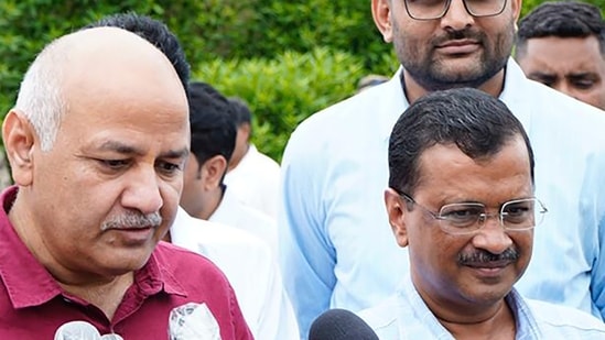 Delhi chief minister Arvind Kejriwal and deputy CM Manish Sisodia interact with media upon their arrival in Ahmedabad.(PTI)