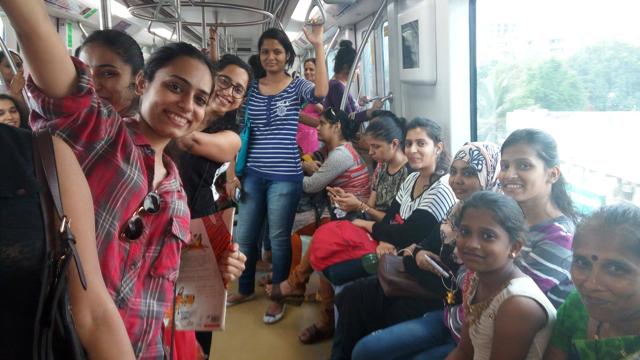 Women on board a metro in Mumbai during the #Antakshriinthemetro session