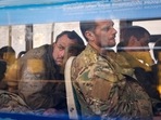 Ukrainian servicemen sit in a bus after they were evacuated from the besieged Mariupol's Azovstal steel plant in Olyonivka, Ukraine.(AP file) Ukrainian servicemen sit in a bus after they were evacuated from the besieged Mariupol's Azovstal steel plant in Olyonivka, Ukraine.(AP file)