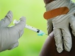 A health worker administers a dose of a Pfizer COVID-19 vaccine at a vaccination clinic. (AP) A health worker administers a dose of a Pfizer COVID-19 vaccine at a vaccination clinic. (AP)
