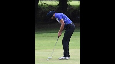 A player in action during the Samarvir Sahi Golf Championship at the Chandigarh Golf Club on Tuesday. (HT)