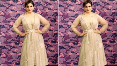 Raveena paired her kurta with a pair of ivory white sharara set that came with uneven wide legs. In white shoes, Raveena aptly accessorised her look. (Instagram/@officialraveenatandon)