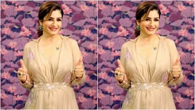 Styled by fashion stylist Richa Ranawat, Raveena wore her tresses into a loose bun with a side part and a few strands of hair left open around her face. (Instagram/@officialraveenatandon)
