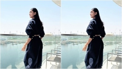 Mrunal decked up in a cropped prussian blue shirt with collars and fluffy quarter sleeves. The cropped shirt came lined with white buttons. (Instagram/@mrunalthakur)
