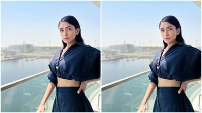 Mrunal teamed her shirt with a pair of high-waisted prussian blue harem pants with pockets on both sides as she posed for the cameras. (Instagram/@mrunalthakur)