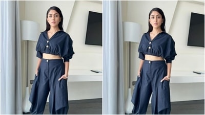 For footwear. Mrunal opted for black boots. "Fit check," she captioned her pictures. (Instagram/@mrunalthakur)