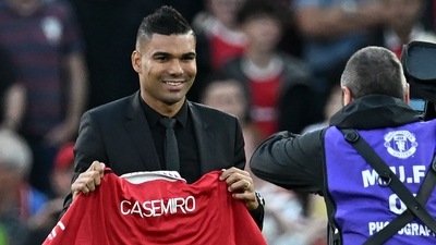 Casemiro is photographed with a United shirt as he is introduced to supporters ahead of the Premier League match between Manchester United and Liverpool at Old Trafford. (AFP) Casemiro is photographed with a United shirt as he is introduced to supporters ahead of the Premier League match between Manchester United and Liverpool at Old Trafford. (AFP)