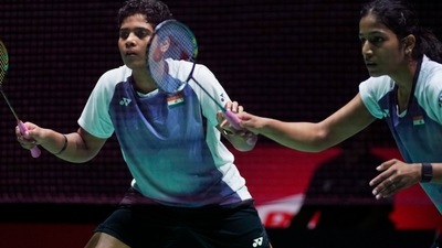 Treesa Jolly and Gayatri Gopichand Pullela compete in a badminton game of the women's doubles against Low Yeen Yuan of Malaysia and Valeree Siow in the BWF World Championships. (AP) Treesa Jolly and Gayatri Gopichand Pullela compete in a badminton game of the women's doubles against Low Yeen Yuan of Malaysia and Valeree Siow in the BWF World Championships. (AP)