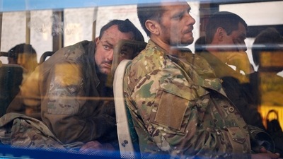 Ukrainian servicemen sit in a bus after they were evacuated from the besieged Mariupol's Azovstal steel plant in Olyonivka, Ukraine. (AP file) Ukrainian servicemen sit in a bus after they were evacuated from the besieged Mariupol's Azovstal steel plant in Olyonivka, Ukraine. (AP file)