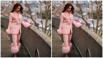 Tamannah accessorised the blush-pink outfit with beige pointed high heels, statement pearl gold rings, and matching pearl drop earrings. In the end, Tamannaah chose bold red lip shade, centre-parted open wavy hairdo, subtle eye shadow, dewy base, blushed cheeks, and mascara on the lashes for the glam picks. (Instagram) Tamannah accessorised the blush-pink outfit with beige pointed high heels, statement pearl gold rings, and matching pearl drop earrings. In the end, Tamannaah chose bold red lip shade, centre-parted open wavy hairdo, subtle eye shadow, dewy base, blushed cheeks, and mascara on the lashes for the glam picks. (Instagram)