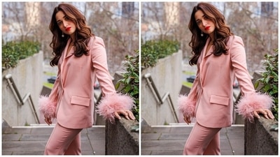 Tamannaah teamed the blazer with matching blush-pink pants that could easily be a part of your summer staples. It features feather trim detailing on the hemline, contrast satin waistband, fitted silhouette, and pocket detailing on the back. (Instagram) Tamannaah teamed the blazer with matching blush-pink pants that could easily be a part of your summer staples. It features feather trim detailing on the hemline, contrast satin waistband, fitted silhouette, and pocket detailing on the back. (Instagram)