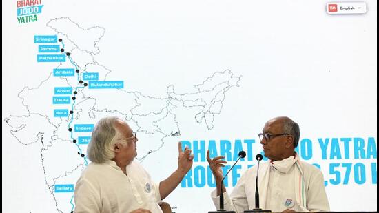 Senior Congress leaders Digvijaya Singh and Jairam Ramesh unveiled the tagline of the Bharat Jodo Yatra, ‘Mile Kadam, Jude Vatan’ in New Delhi on Tuesday. (ANI)