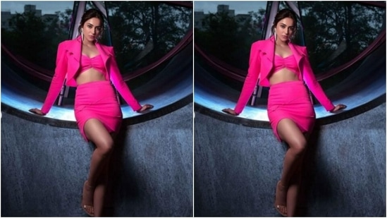 Rakul Preet decked in a punk corset bra and a mini pink pencil skirt. She added more drama to her look with a cropped pink jacket with dramatic collars.(Instagram/@rakulpreet)