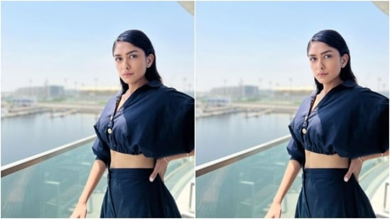 Mrunal poses for the cameras by teaming her shirt with Prussian blue harem pants with pockets on both sides.(Instagram/@mrunalthakur)