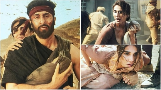 Ranbir Kapoor and Vaani Kapoor holding a ‘baby’ in stills from Shamshera.&nbsp;