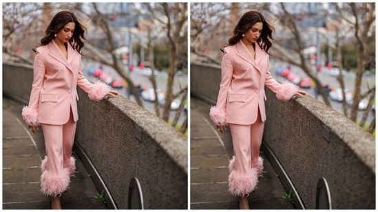 Tamannah accessorised the blush-pink outfit with beige pointed high heels, statement pearl gold rings, and matching pearl drop earrings. In the end, Tamannaah chose bold red lip shade, centre-parted open wavy hairdo, subtle eye shadow, dewy base, blushed cheeks, and mascara on the lashes for the glam picks.(Instagram)