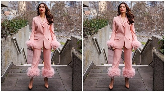 Tamannaah's blush pink ensemble effortlessly mixes glamour and elegance. It features a chic blazer created from crepe and satin fabric, designed with feather detailing on cuffs for maximum impact. It also has notch lapel collars, padded shoulders, full-length sleeves, front button closures, patch pockets, and a tailored fit.(Instagram)