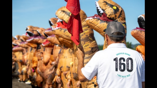 People in T-Rex dinosaur costumes, running the race at Washington. (Rachael Jones/Seattle Refined) People in T-Rex dinosaur costumes, running the race at Washington. (Rachael Jones/Seattle Refined)