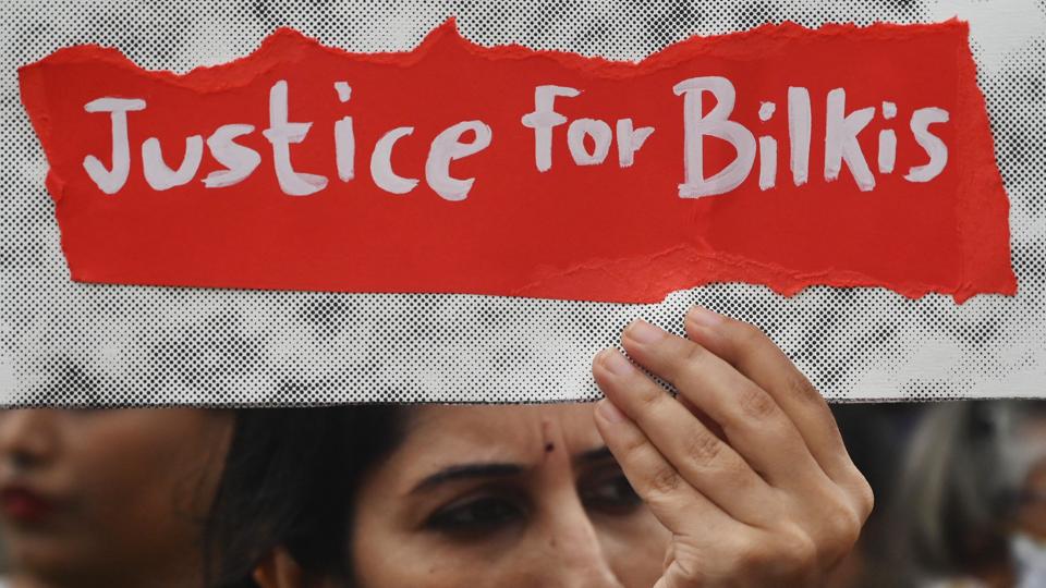 A woman holds a placard during a protest against the release of men convicted of gang-raping Bilkis Bano during the 2002 communal riots in Gujarat. (AFP) A woman holds a placard during a protest against the release of men convicted of gang-raping Bilkis Bano during the 2002 communal riots in Gujarat. (AFP)