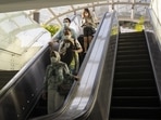 Shoppers ride an escalator on Orchard Road in Singapore. Singapore to drop most indoor facemask rules next week as Covid-19 situation stabilises (Ore Huiying/Bloomberg) Shoppers ride an escalator on Orchard Road in Singapore. Singapore to drop most indoor facemask rules next week as Covid-19 situation stabilises (Ore Huiying/Bloomberg)
