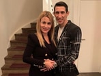 Angel Di Maria poses for a photo with his wife.
