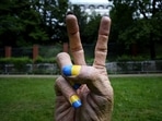 A statue of a hand with finger nails painted in Ukraine's national colors was placed in front of the Russian embassy in Prague, Czech Republic.(AP)