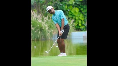 A player in action during the Samarvir Sahi Golf Championship being held at the Chandigarh Golf Club greens on Wednesday. (HT)